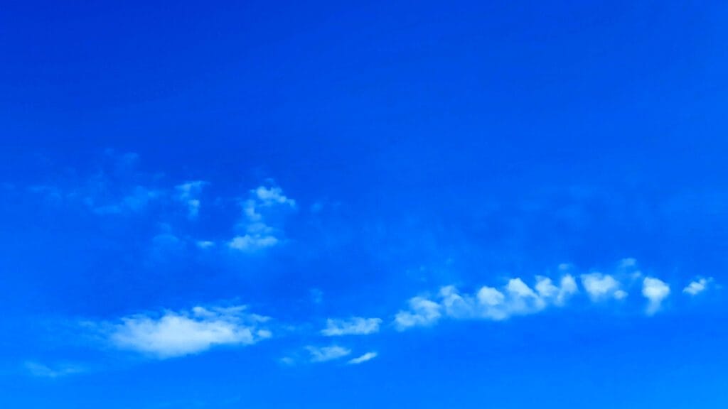 Clear blue sky with white clouds